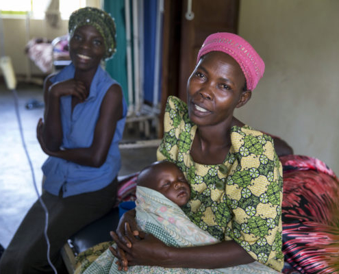 Two women and a baby at a maternity ward in Uganda
