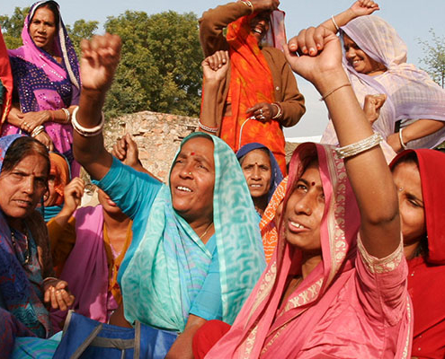 Several women raising their hands