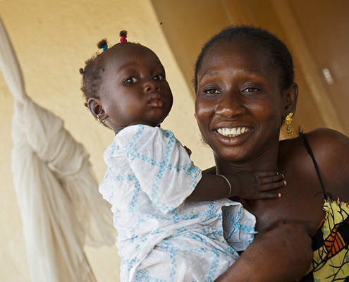 A Senegalese mother holds her toddler