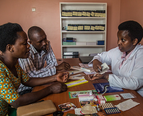 A nurse counsels clients a couple on family planning in Rwanda