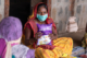 A woman at an AWW community meeting in Gujarat