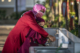 A mother helps her daughter wash her hands in Indonesia