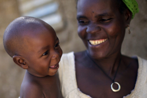A mother and her baby son smile in Niger