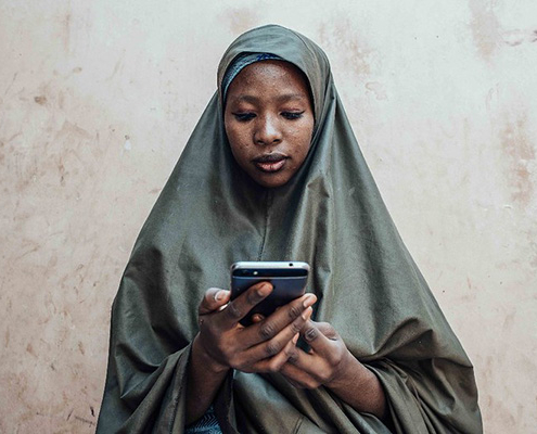 A woman on a mobile device Nigeria