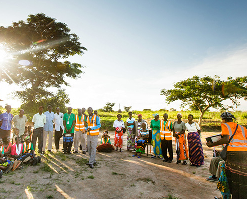 A group is engaged by a community leader in Zambia