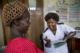 A nurse counseling a pregnant woman at her checkup
