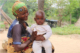 Nigerian mother holding her baby son