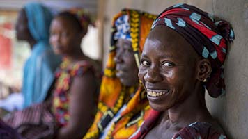Women wait to receive sexual reproductive health services at a mobile clinic in Senegal