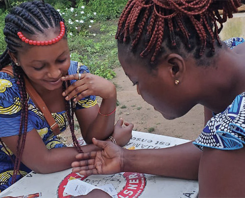 Two women using the Empathways card deck in Togo