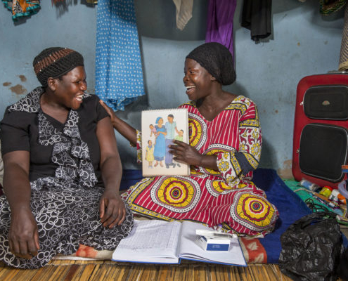 Community health worker provides family planning and contraceptive counseling during a home visit in Uganda