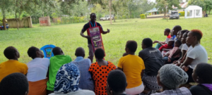 A youth champion speaks in front of a group in Kenya