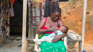 Congolese mother breastfeeds her baby