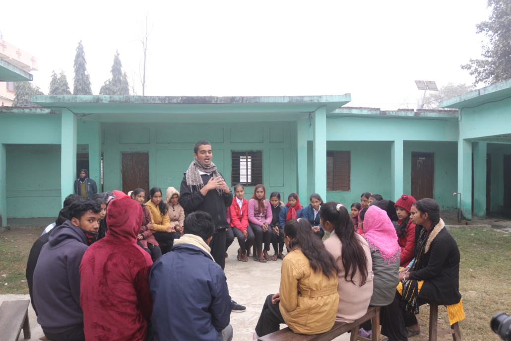 An adolescent boy leads a child club meeting in Madhesh Province, Nepal.