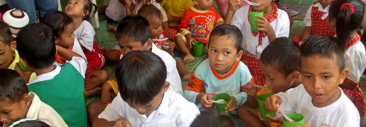 Children eating as part of the Early Childhood Education and Development Program in Indonesia
