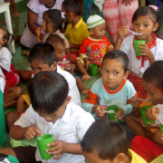 Children eating as part of the Early Childhood Education and Development Program in Indonesia