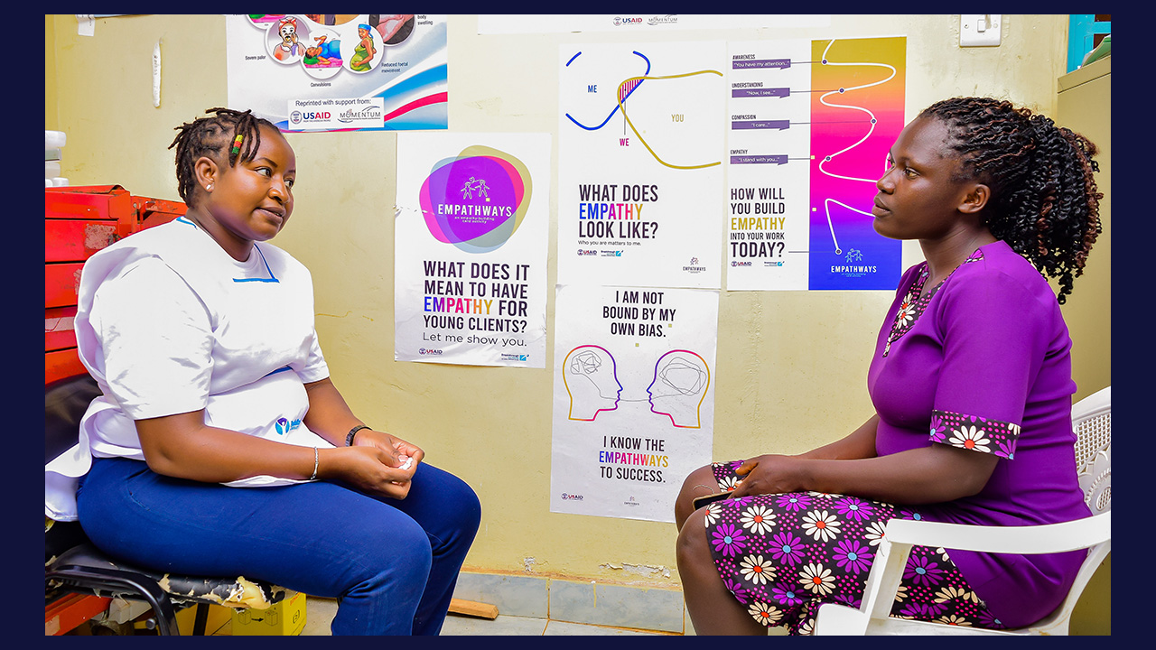 Female provider speaking with a young woman