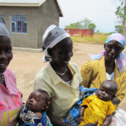 Two mothers holding their babies in South Sudan