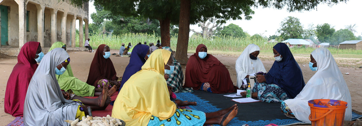 Women gather outdoors in Nigeria