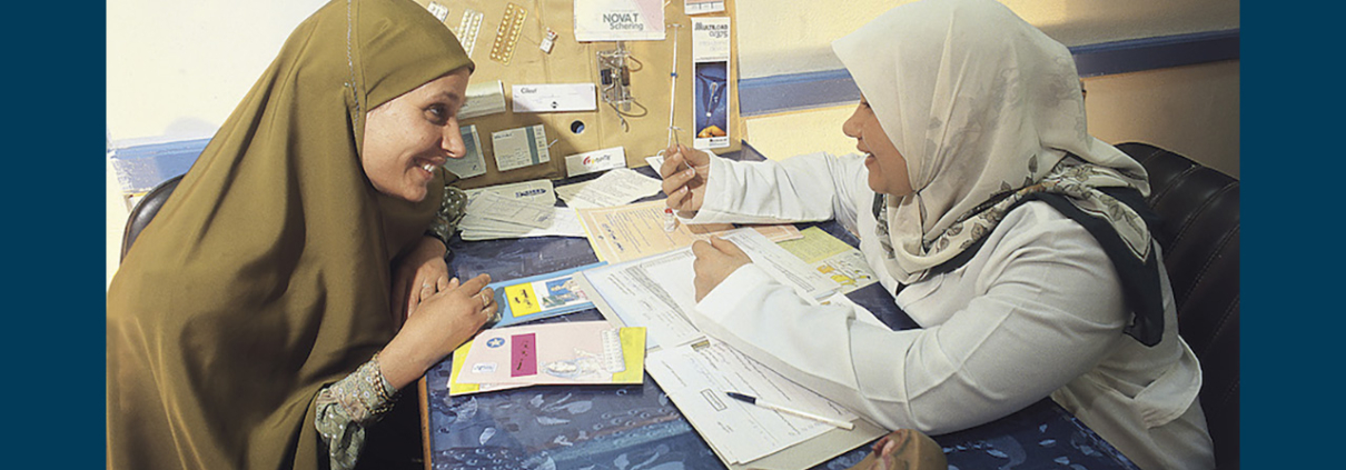 A female providers provides family planning options to a female patient