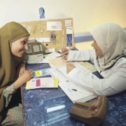 A female providers provides family planning options to a female patient