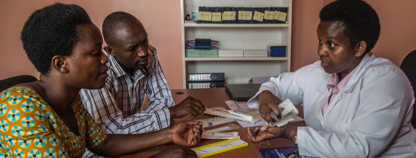 A couple receive counseling about contraceptive methods available to them from a nurse in Rwanda