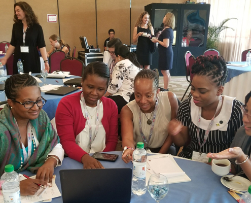 Zika implementing partners participate in a share fair to discuss community engagement in the USAID Zika response