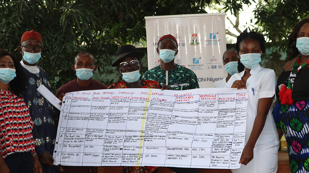 Ward Development Council members pose with a joint action plan developed by health providers and community members in Egwudinagu ward, Ebonyi State, Nigeria.