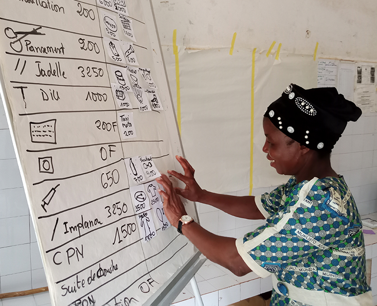 A female community leader during the Cost Comparison activity in Togo.