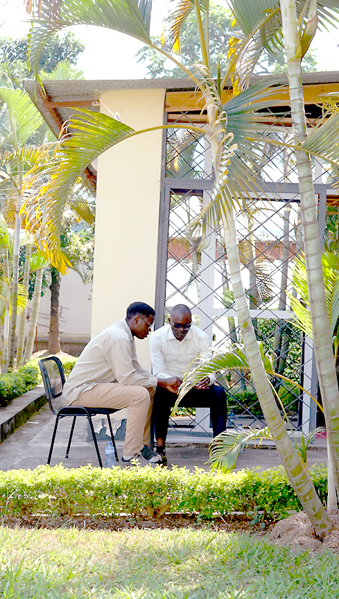 An adolescent boy and a father playing an Empathways prototype in Bujumbura, Burundi. 