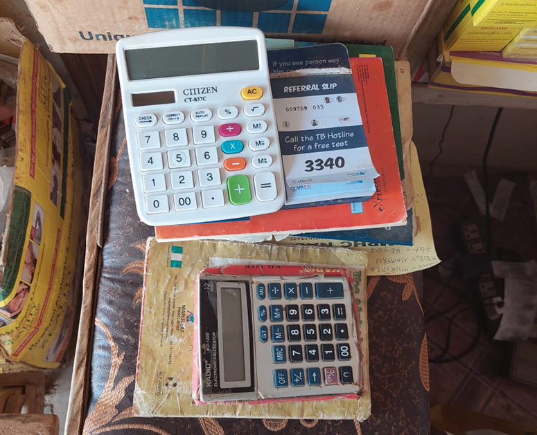 Referral pad attached to desk calculator