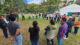 A larger group stands in a circle outside in Guatemala