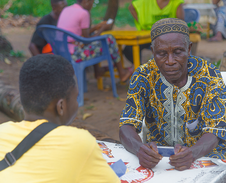 Two people playing Community Empathways in Togo