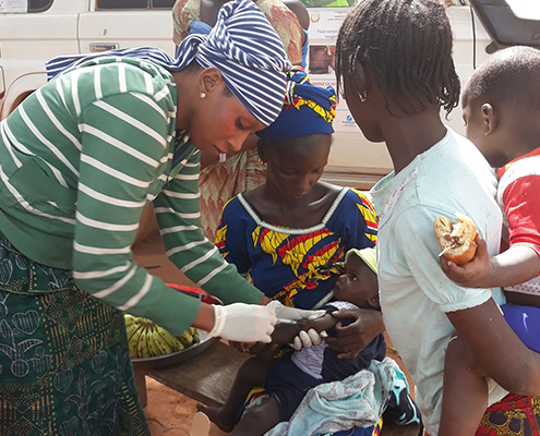 Baby getting the malaria vaccine in Guinea