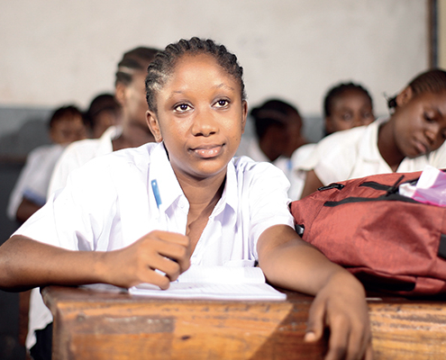 Adolescent girl in a classroom in the DRC