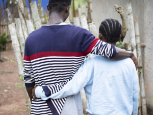 Namomie and her boyfriend walking outdoors in Côte d’Ivoire